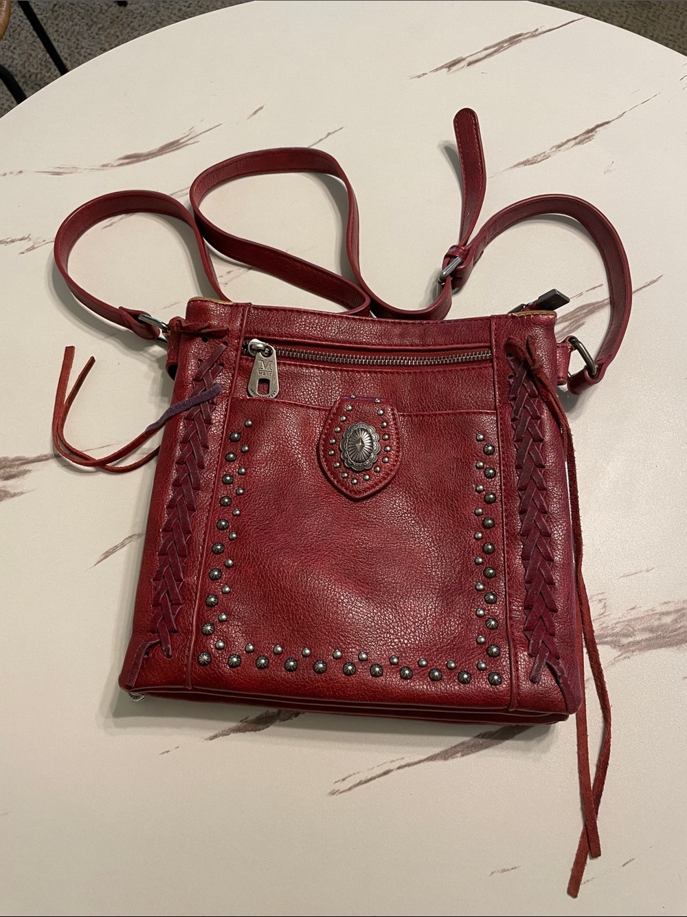 Montana West Burgundy studded crossed shoulder Bag.
